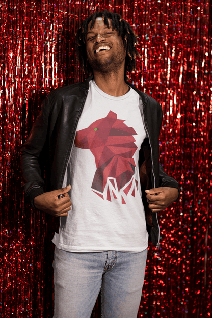 A happy man standing against a red foil fringe curtain while posing in a Bella+Canvas 3001 White Tee with our Polygonal Bear design shown front and center.