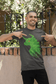 A bearded man happily pointing at our Fragmented Bullish designed on an Asphalt colored T-shirt.