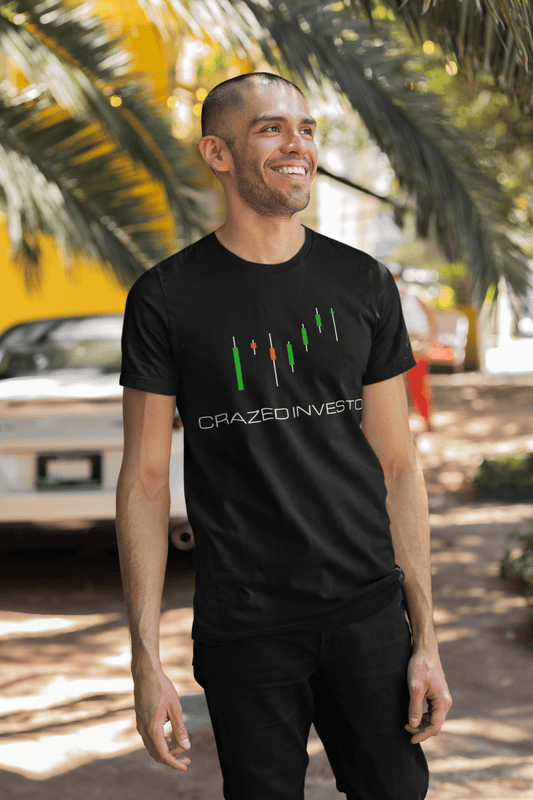 Mockup of a happy man posing in our Black shirt of our Crazed Investor designed logo with candlestick patterns above, showing a bullish pattern.